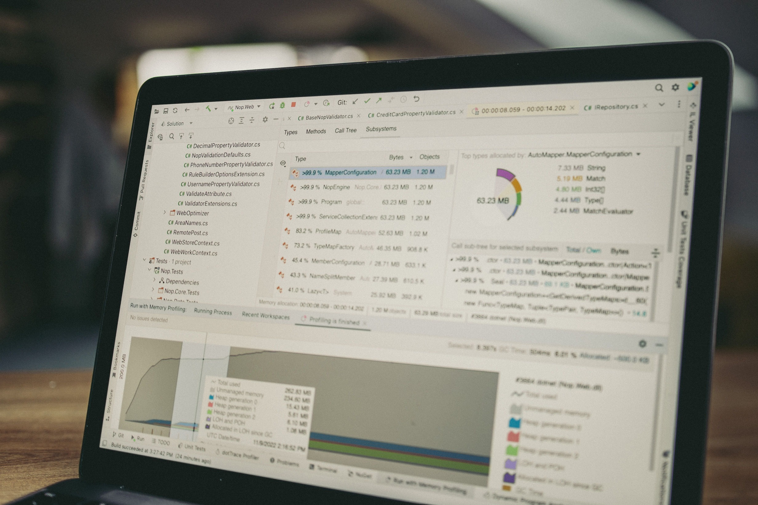 IT professional setting up a Mobile Device Management (MDM) solution on a laptop to securely deploy and manage enterprise devices.