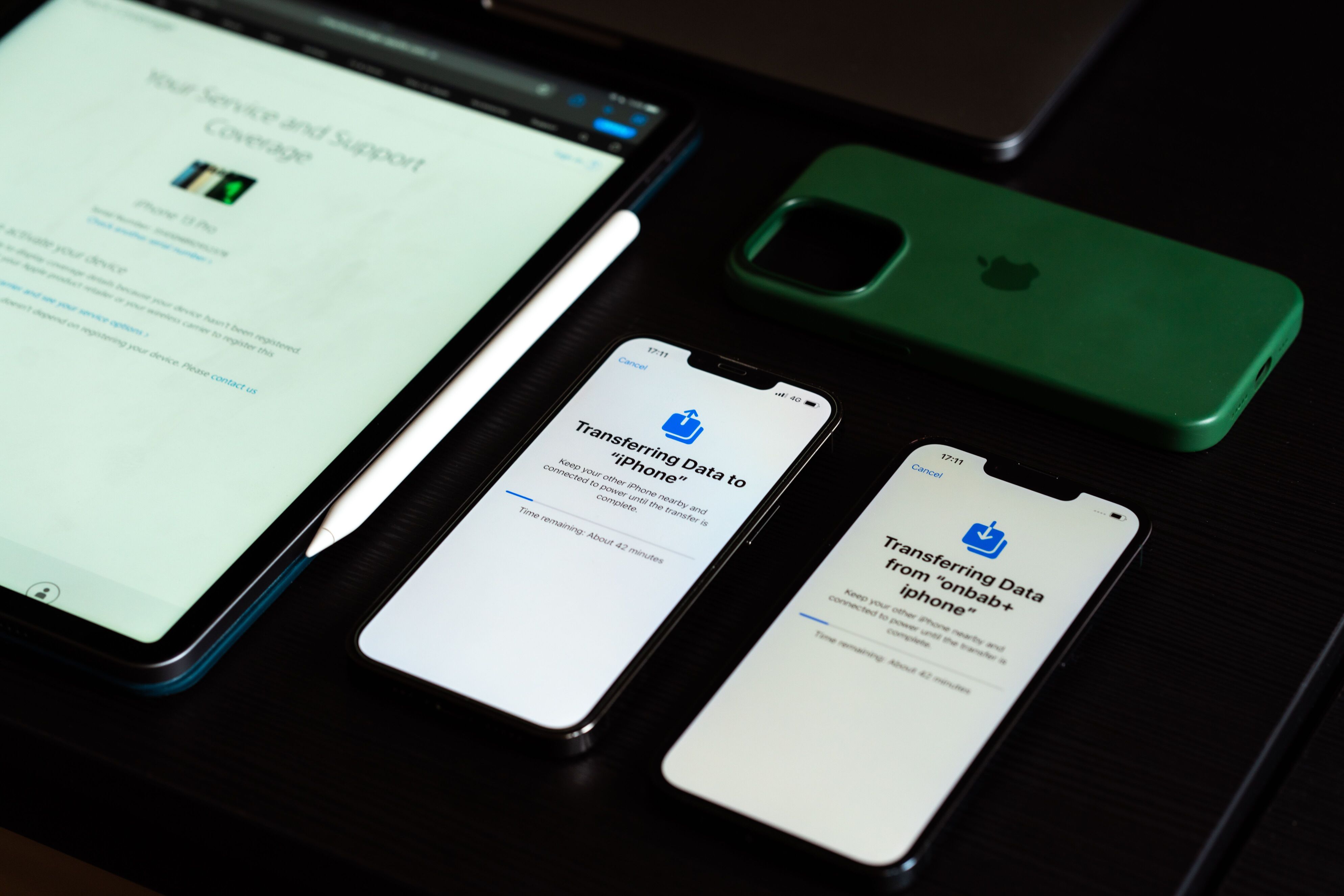 Apple iPhones and iPad displaying device setup and data transfer screens, illustrating common Apple MDM errors during device enrollment and configuration.